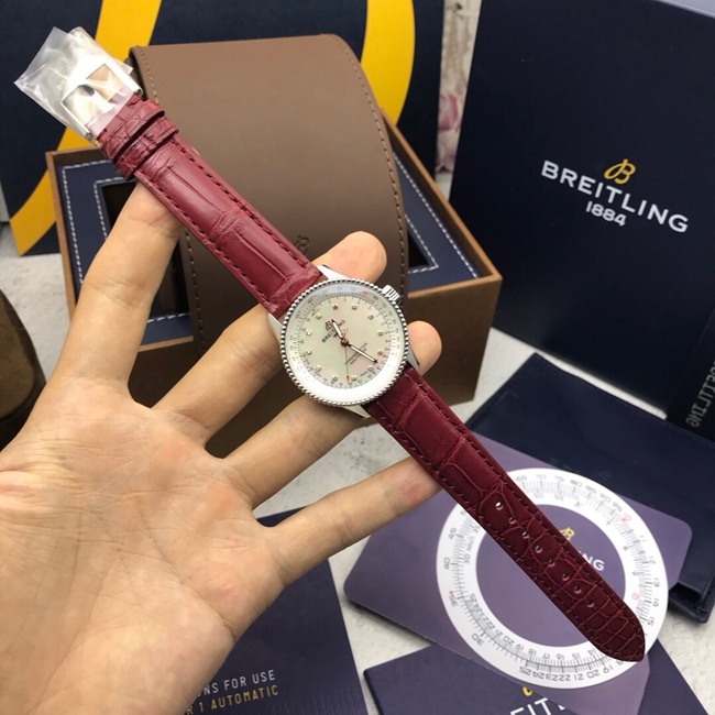 顶级复刻原单手表百年灵女款白盘红带自动机械航空计时皮带手表正面图