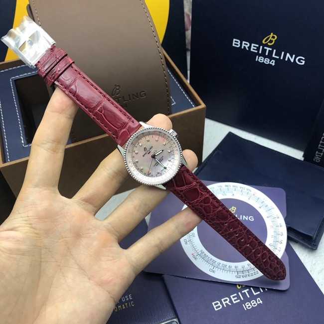 顶级复刻原单手表百年灵女款粉盘红带航空计时系列自动机械皮带手表正面图