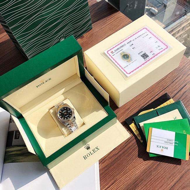 顶级复刻劳力士原单手表女士日志型系列黑盘间金带全自动机械正面图