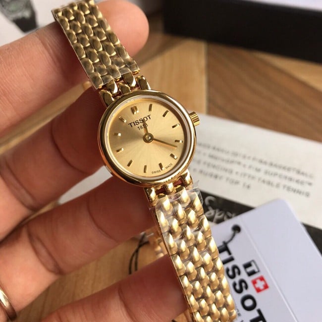 顶级复刻天梭高仿石英原单手表T058系列女装金盘金带正面图