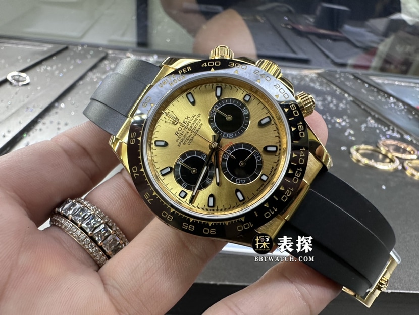 劳力士宇宙计型迪通拿真金真钻定制超A高仿手表男士香槟色熊猫盘余文乐同款橡胶款正面实拍图