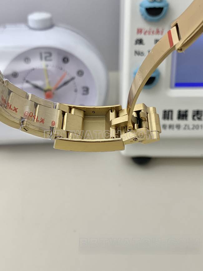QF厂1:1复刻手表迪通拿劳力士黑盘黄金4131机械表扣实拍图